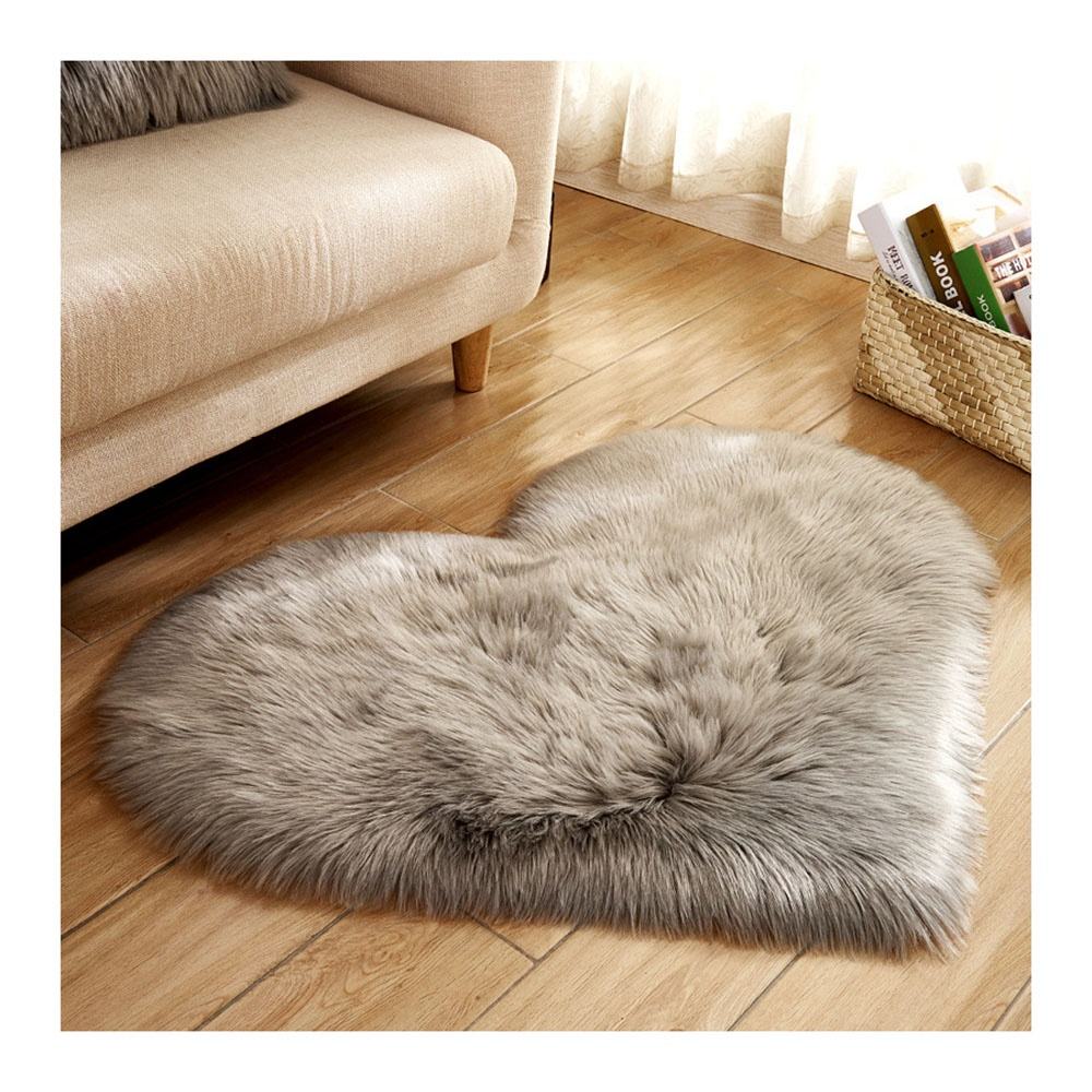 Small pink faux fur rug, washable.