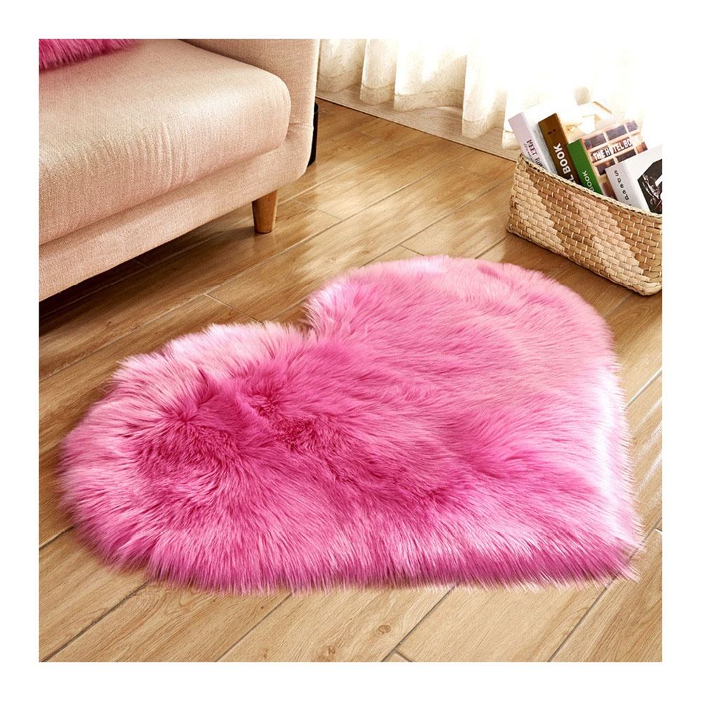 Small pink faux fur rug, washable.
