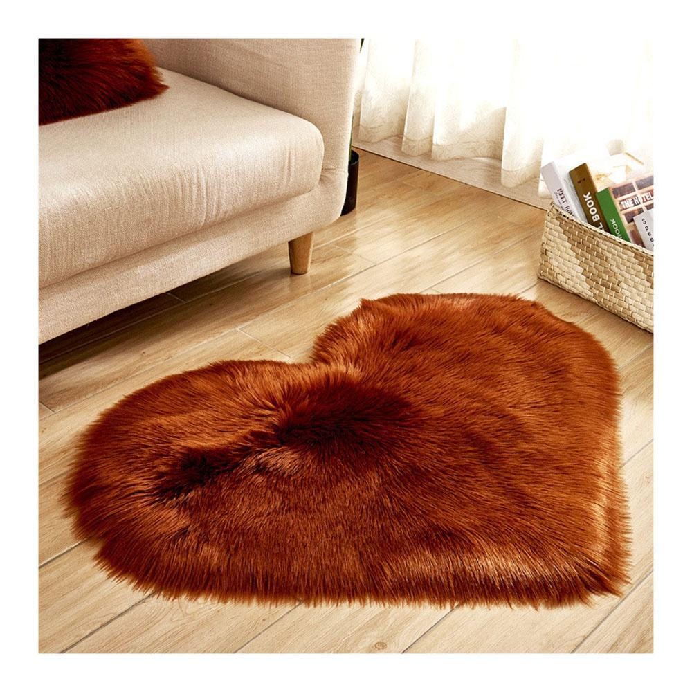 Small pink faux fur rug, washable.