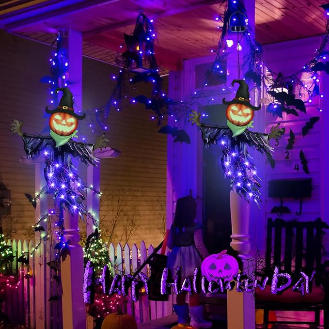 Purple Halloween pumpkin scarecrow solar lights hanging around a decorated porch