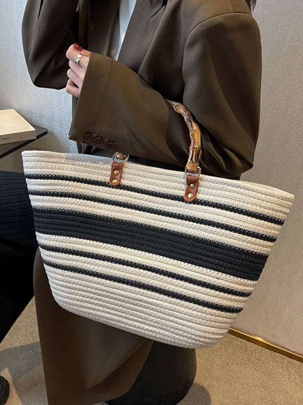 Striped handbags with a contrasting split-joint detail