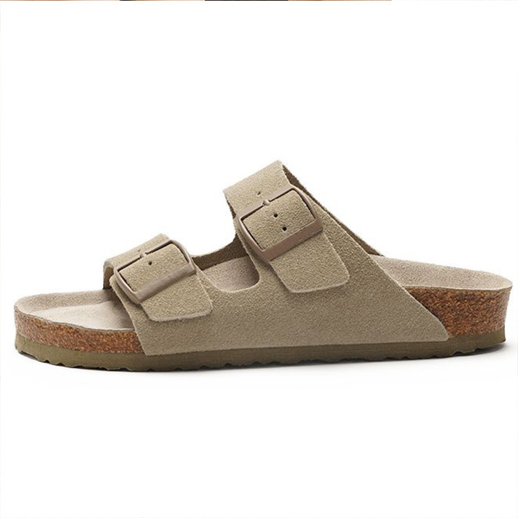 Women's sandals featuring a contoured cork sole that molds to the foot, with an adjustable double-buckle design.