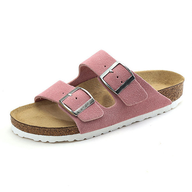 Women's sandals featuring a contoured cork sole that molds to the foot, with an adjustable double-buckle design.
