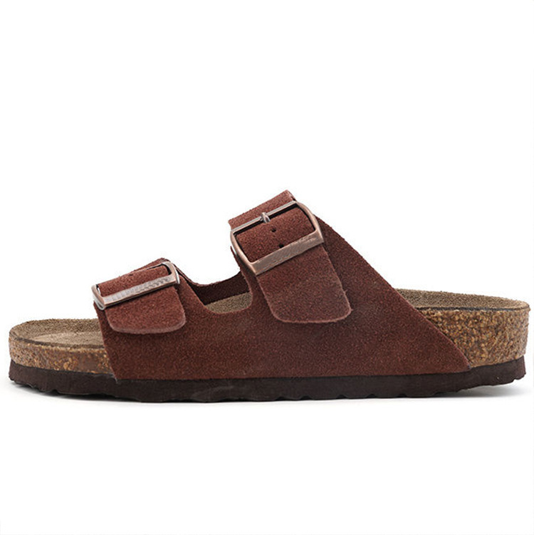 Women's sandals featuring a contoured cork sole that molds to the foot, with an adjustable double-buckle design.
