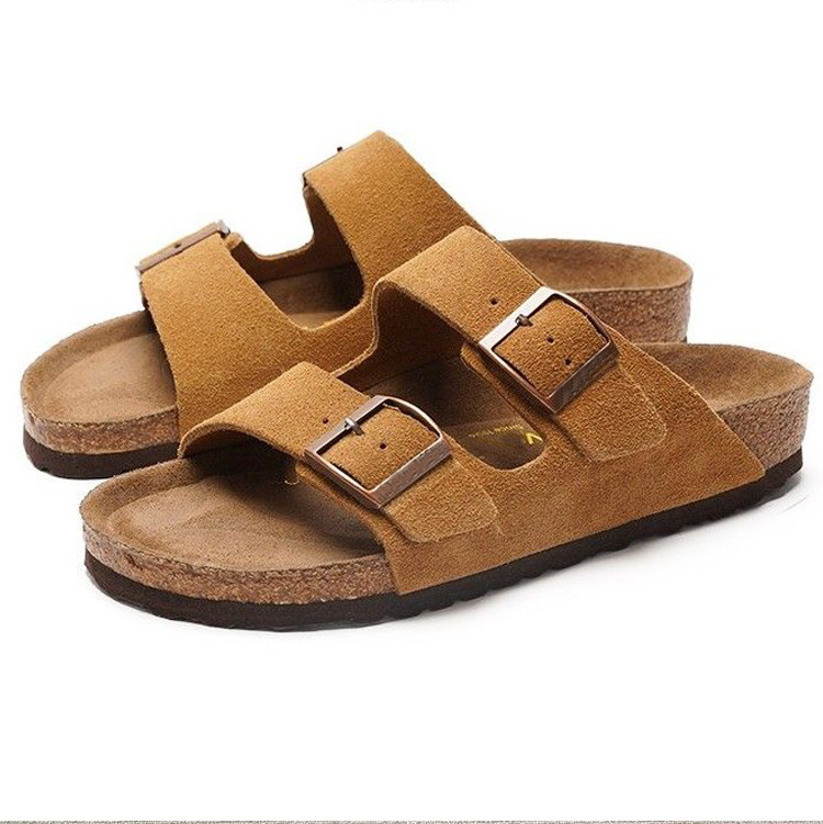 Women's sandals featuring a contoured cork sole that molds to the foot, with an adjustable double-buckle design.