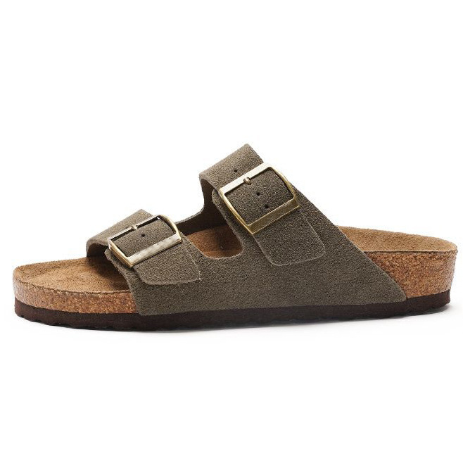 Women's sandals featuring a contoured cork sole that molds to the foot, with an adjustable double-buckle design.