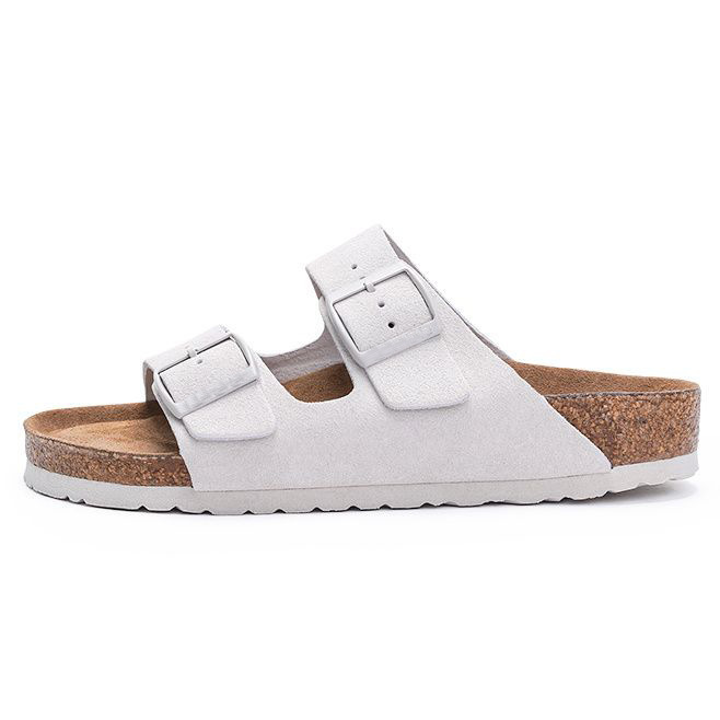 Women's sandals featuring a contoured cork sole that molds to the foot, with an adjustable double-buckle design.