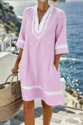 Striped dress, a must-have for summer travel and leisure.