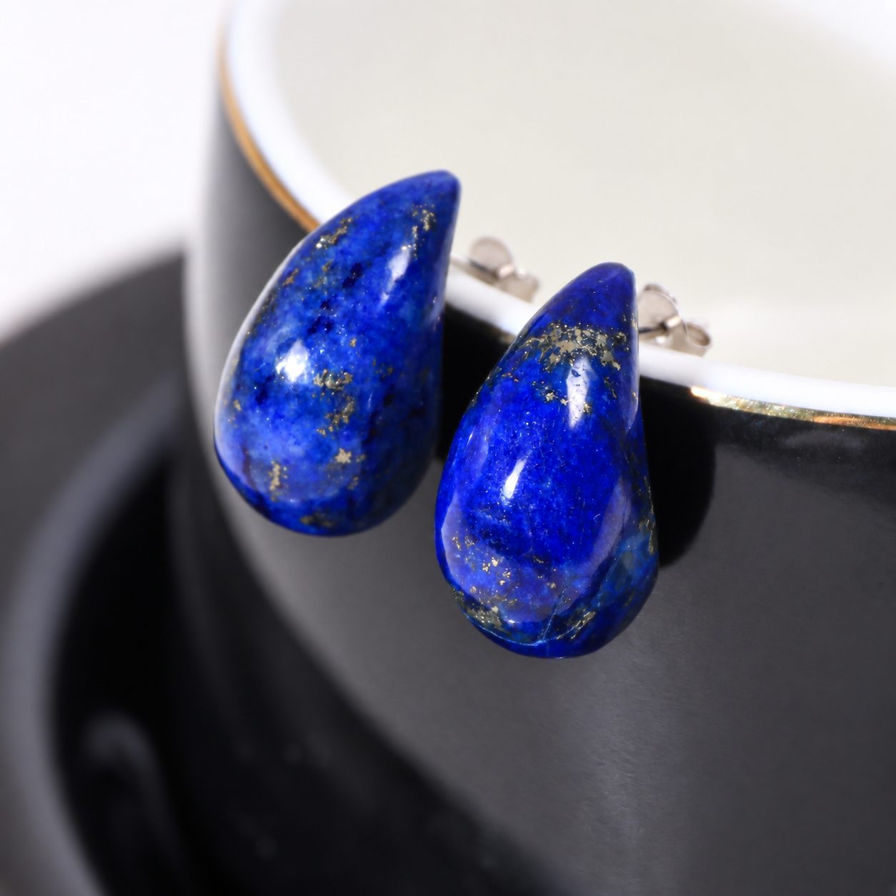 Riverstone teardrop studs in lapis lazuli, deep blue stone with gold pyrite flecks
