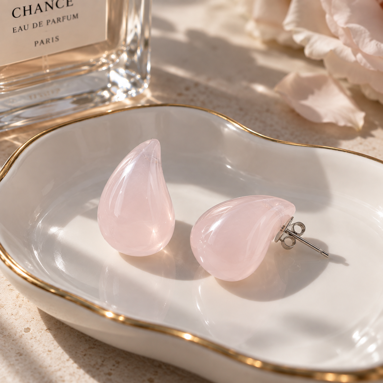 Riverstone teardrop studs in rose quartz, soft translucent pink stone