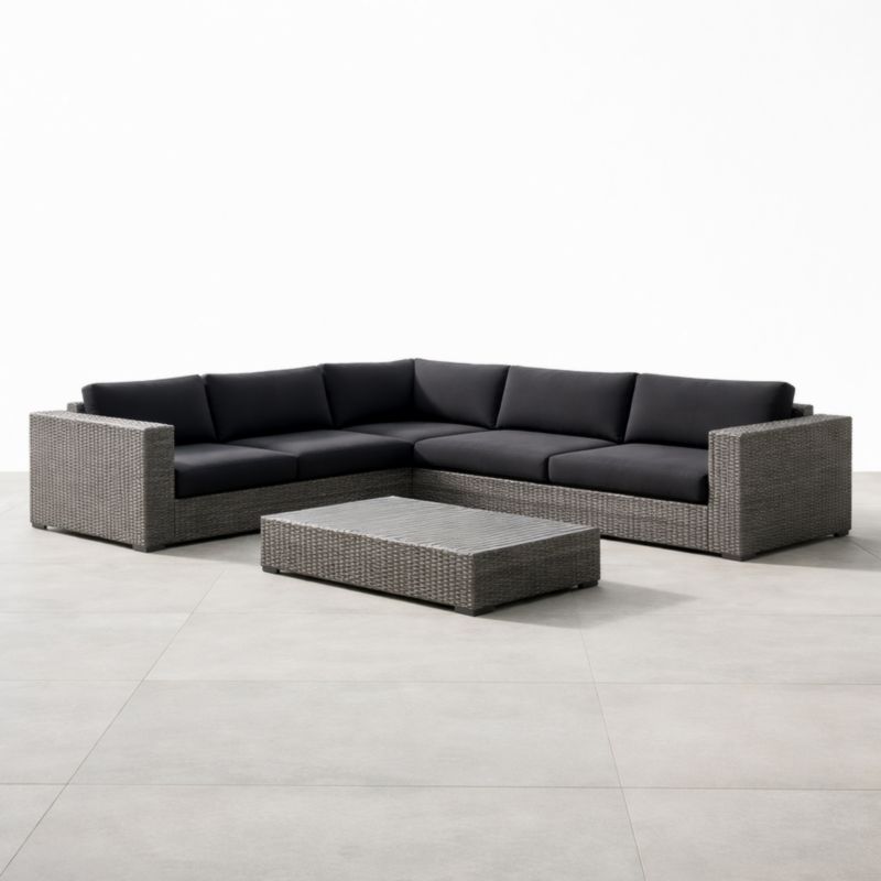 Canapé d'angle en résine tressée avec coussins en polyester