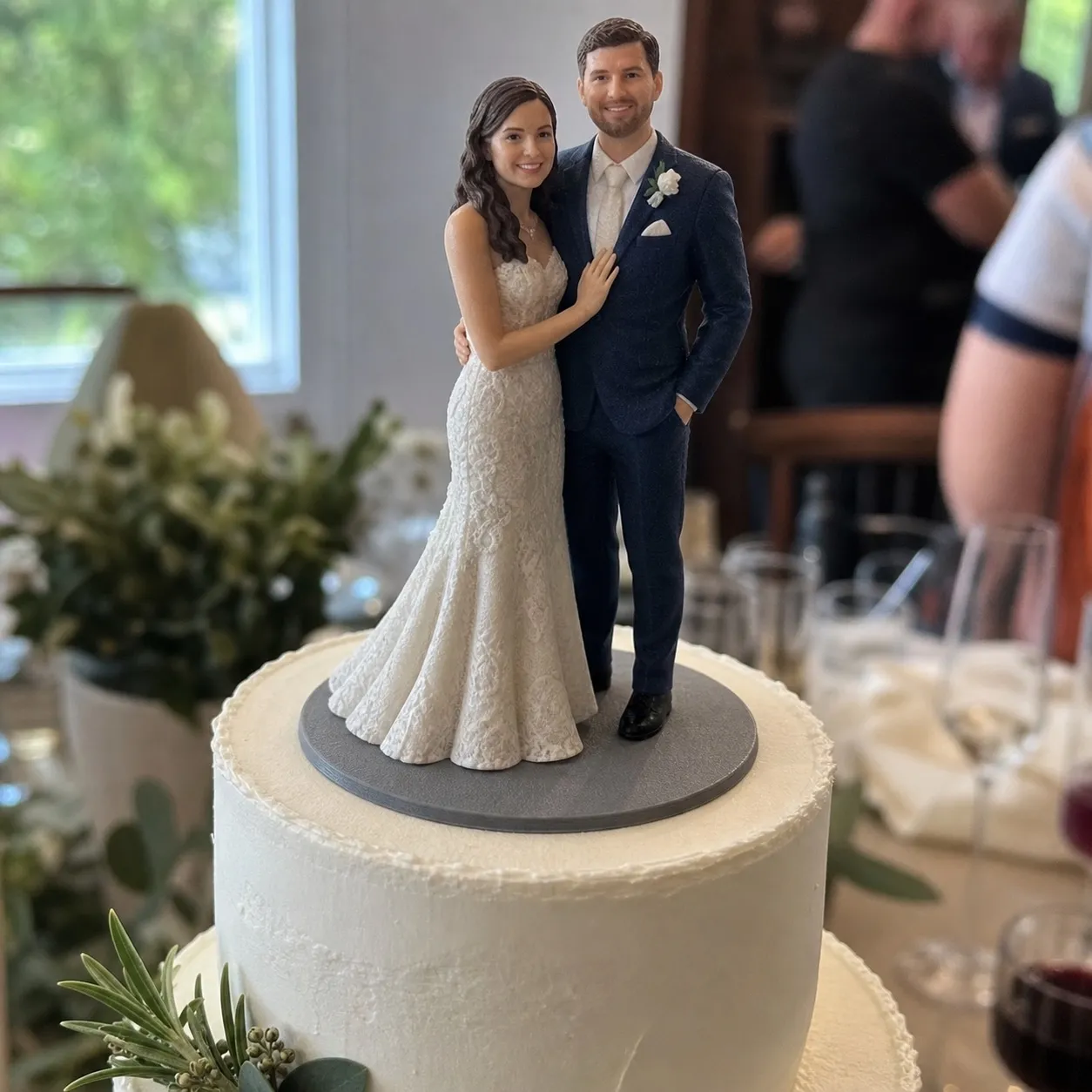 Wedding cake topper figurine from photo with clean bride and groom display