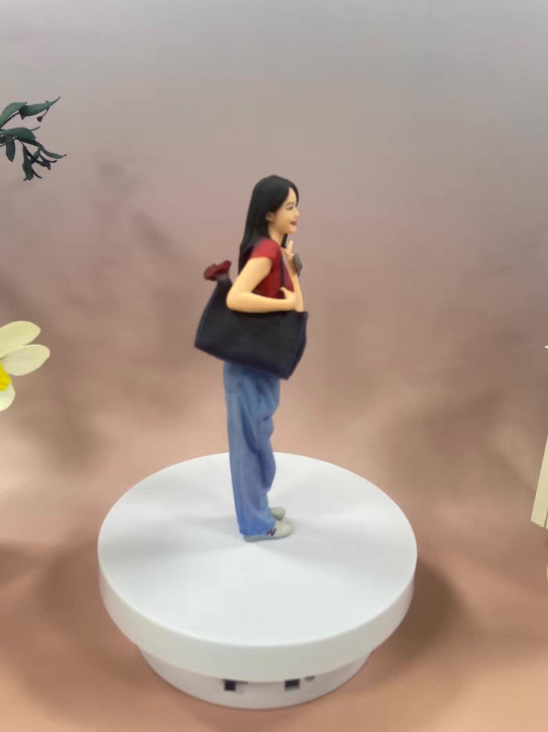 Purple dress figurine shown in side view