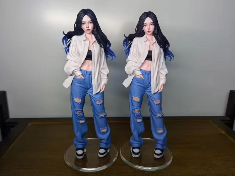 Sports-themed figurine with two cats on the base