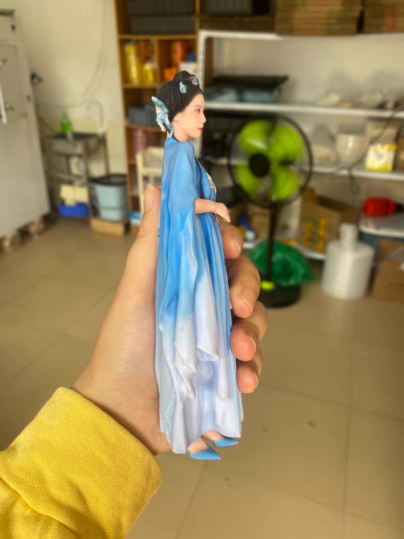 Pair of matching casual custom figurines on display