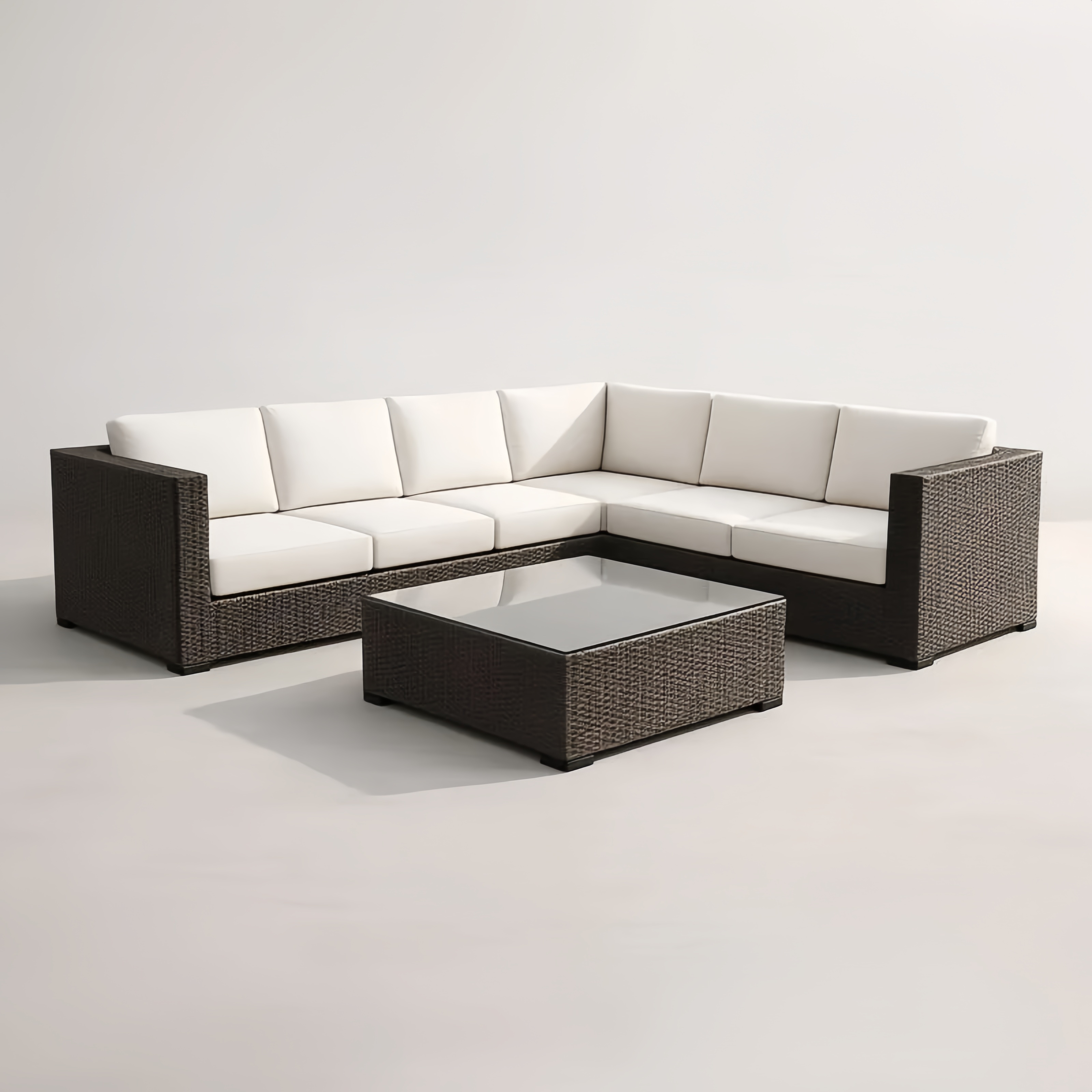 Salon de jardin en résine tressée avec coussins en polyester et table en verre