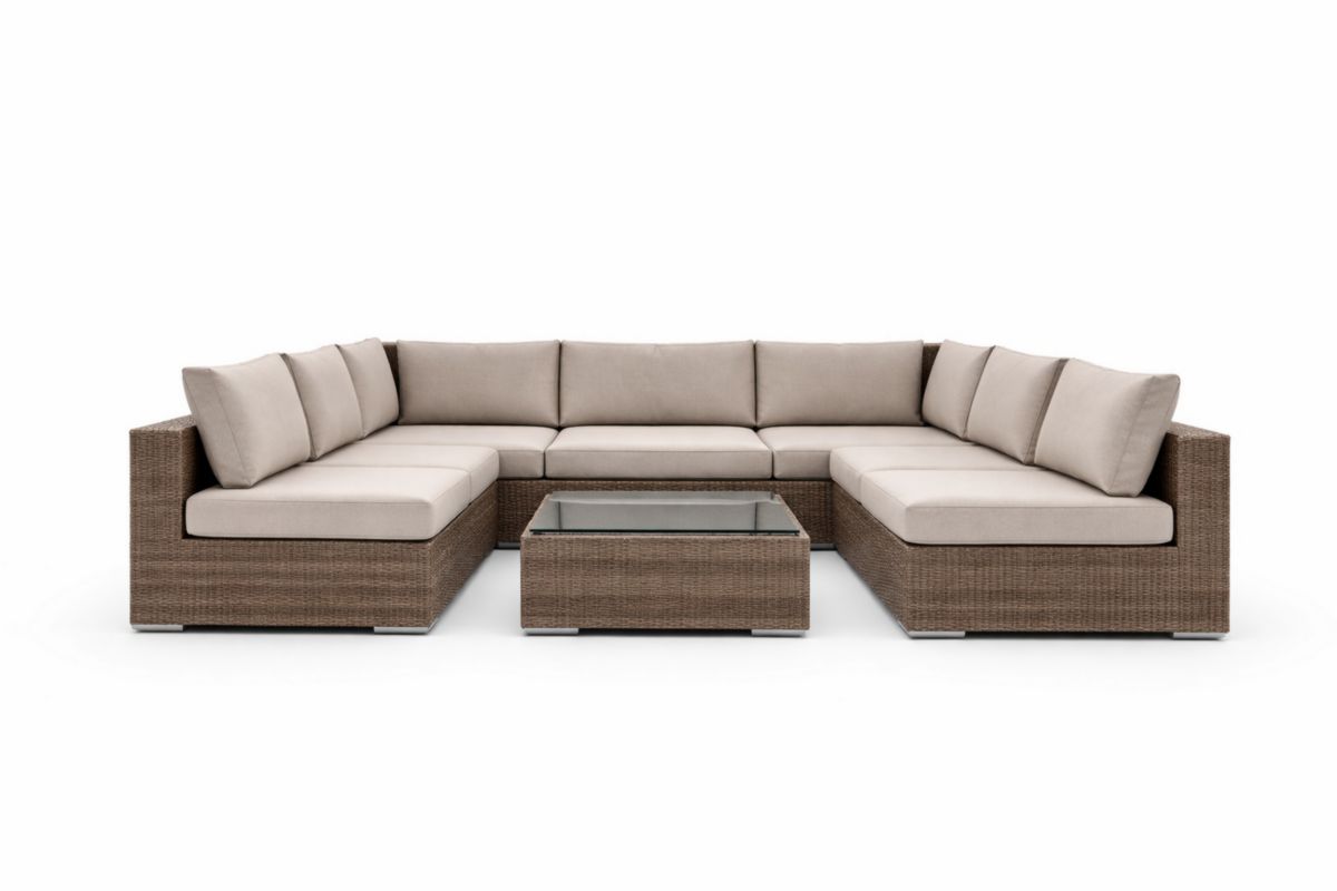 Divano modulare in rattan con cuscini in poliestere e tavolino in vetro