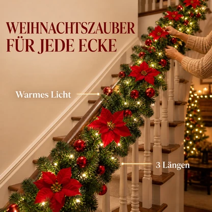 Beleuchtete Weihnachtsgirlande mit roten Weihnachtssternen und warmem Licht