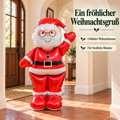 Winkender roter Weihnachtsmann-Folienballon in einem hellen Flur