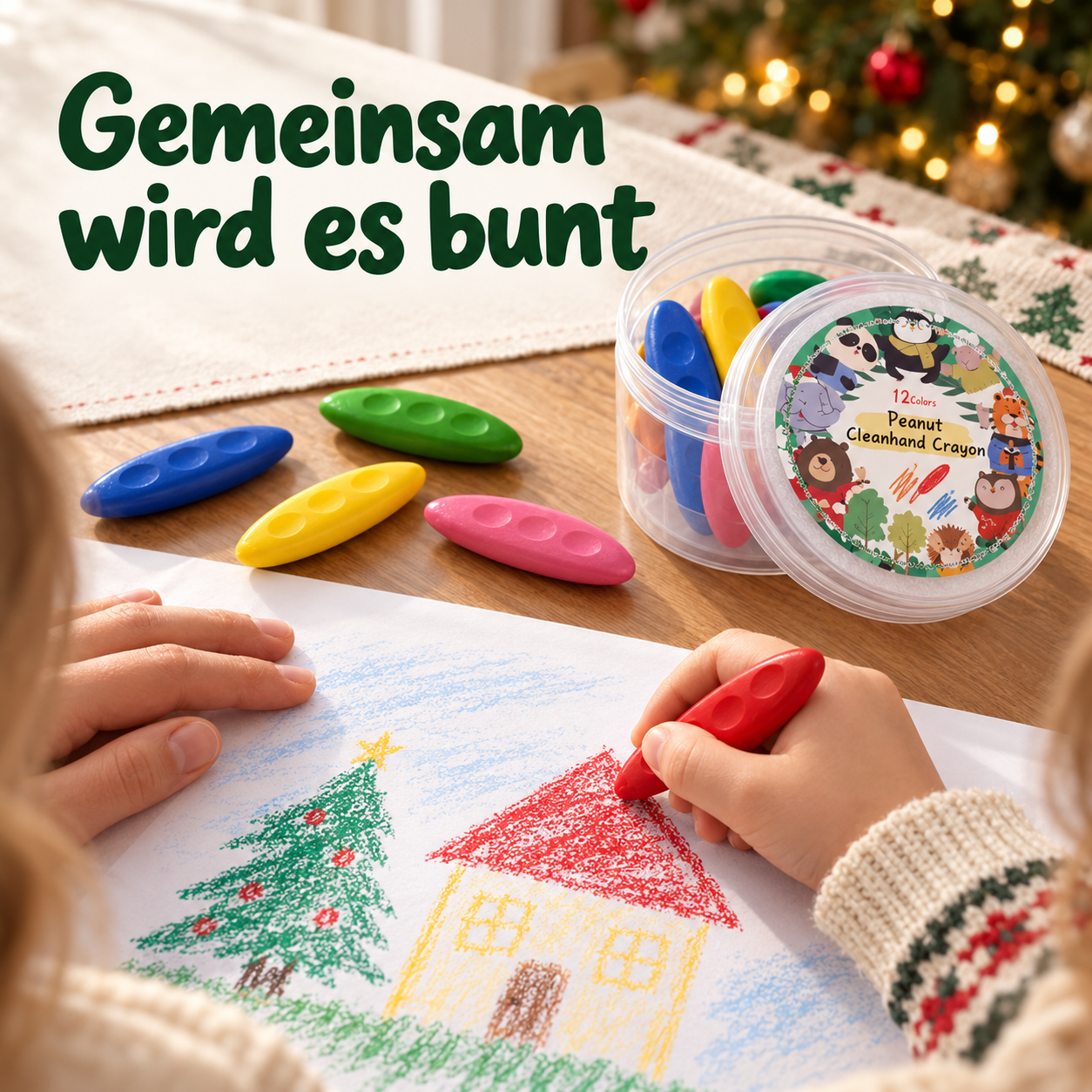 Gemeinsames Malen mit einem roten Wachsmalstift auf Papier