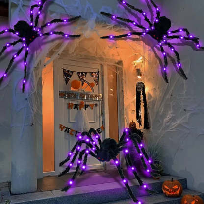 Purple light-up furry spiders around a Halloween porch