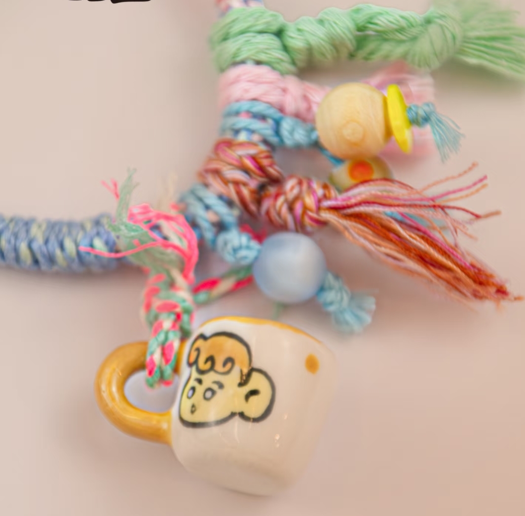 Handwoven phone lanyard charm for hand carrying