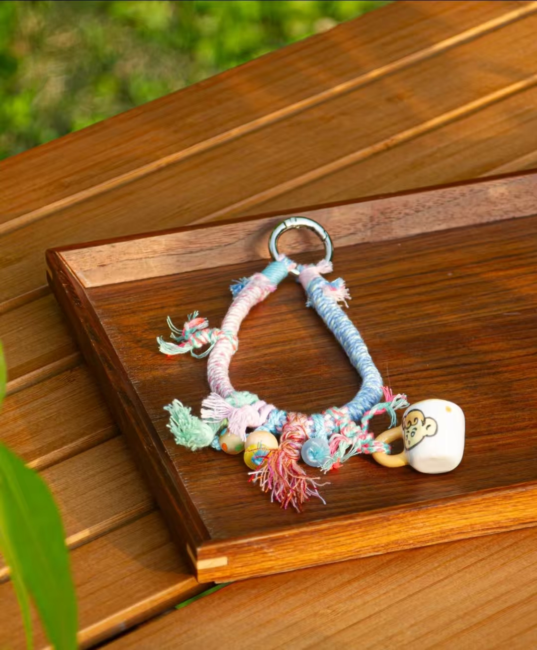 Handwoven phone lanyard charm for hand carrying
