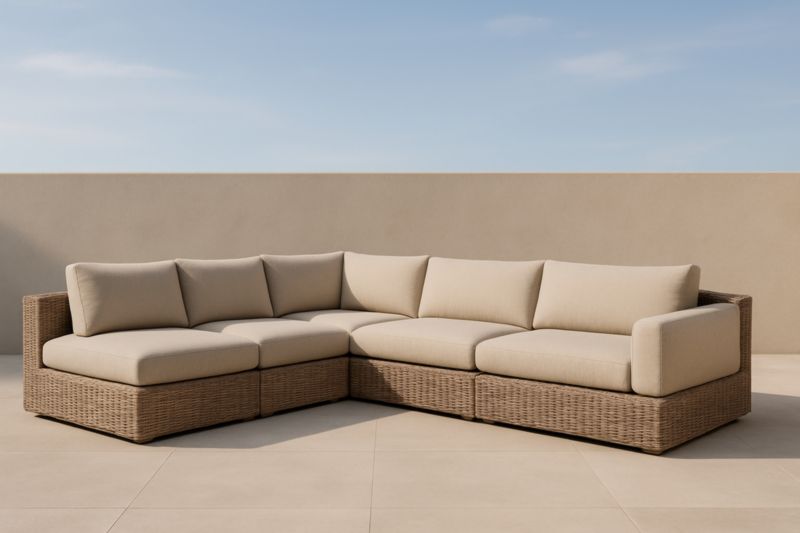 Divano ad angolo modulare da esterno in rattan e cuscini color Crema