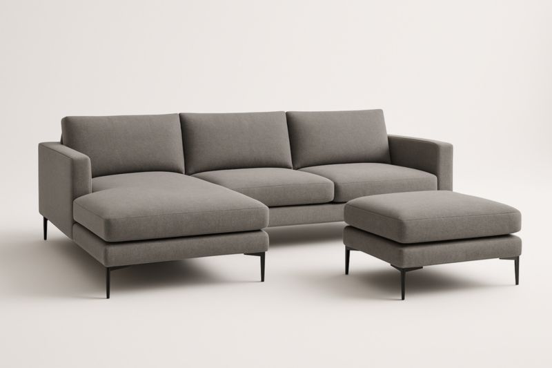 Divano angolare grigio in tessuto con chaise longue e pouf