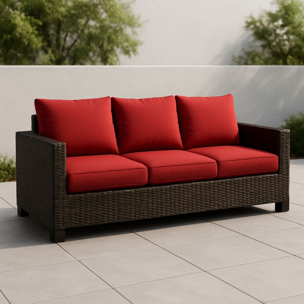 Canapé extérieur trois places rotin marron coussins rouges
