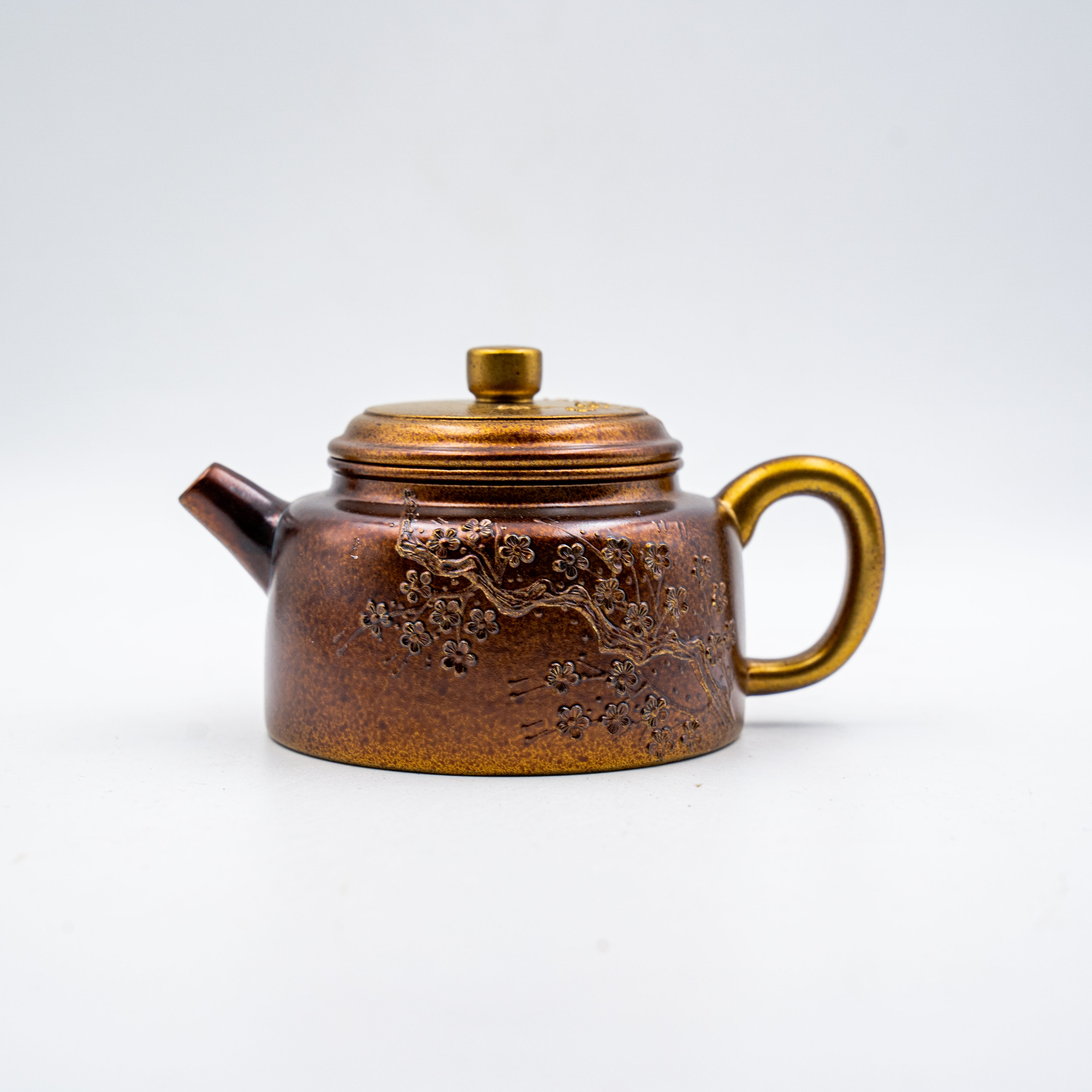 De Zhong Teapot with Plum Blossom Design