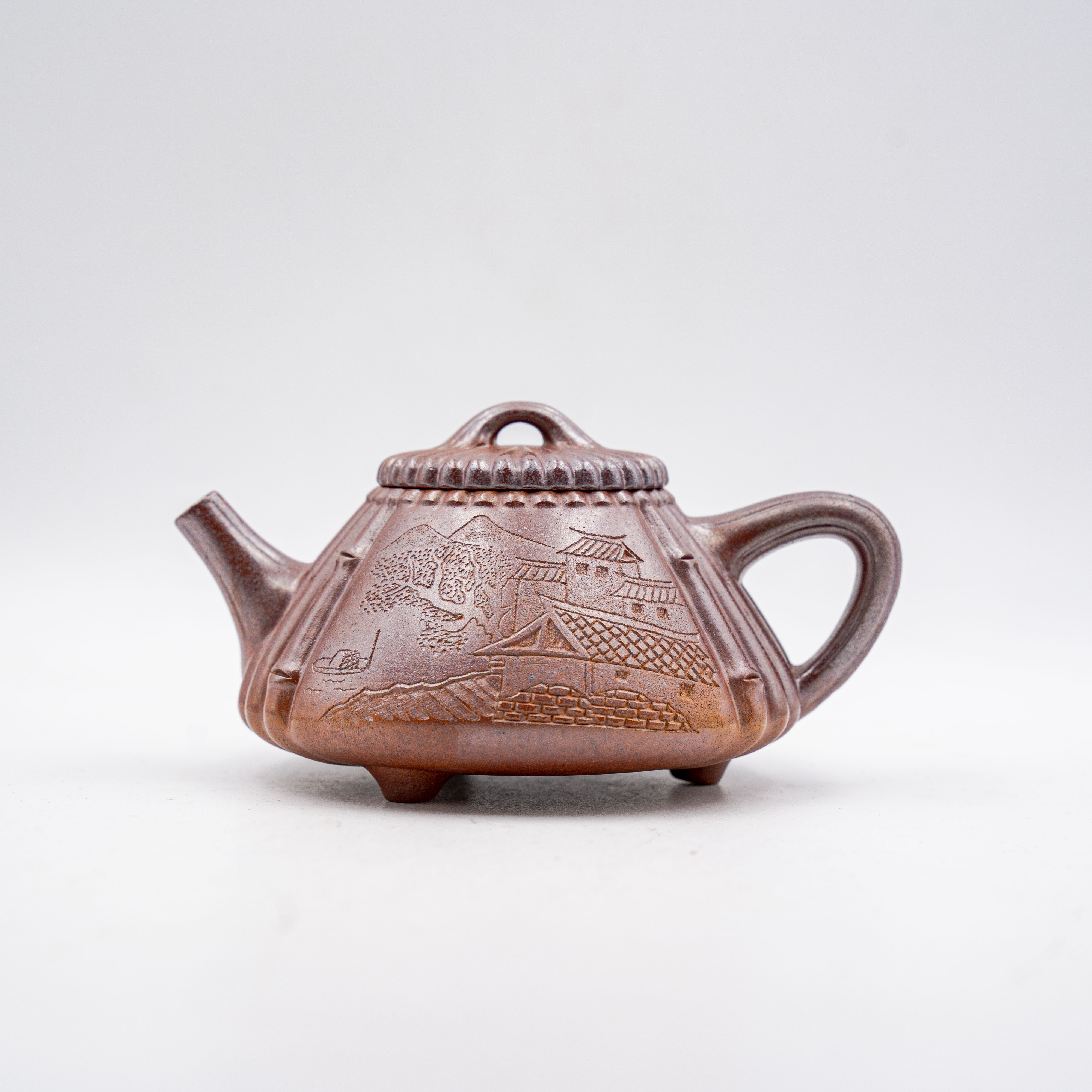 Handcrafted Yixing Zisha Clay Jinsuo Shipiao Teapot with Carved Landscape Design
