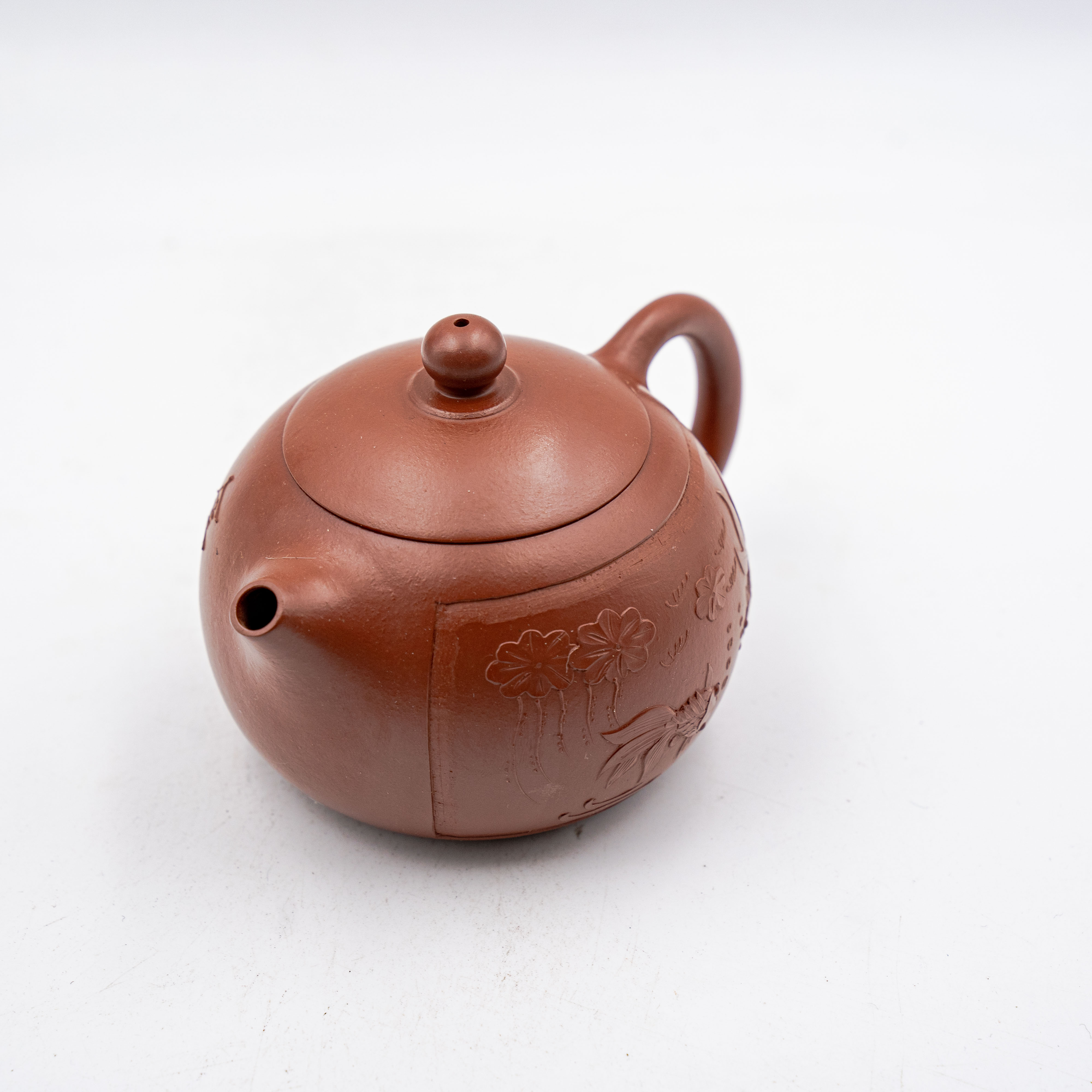 Handcrafted Yixing Red Clay Xishi Teapot with Carved Floral and Fish Design