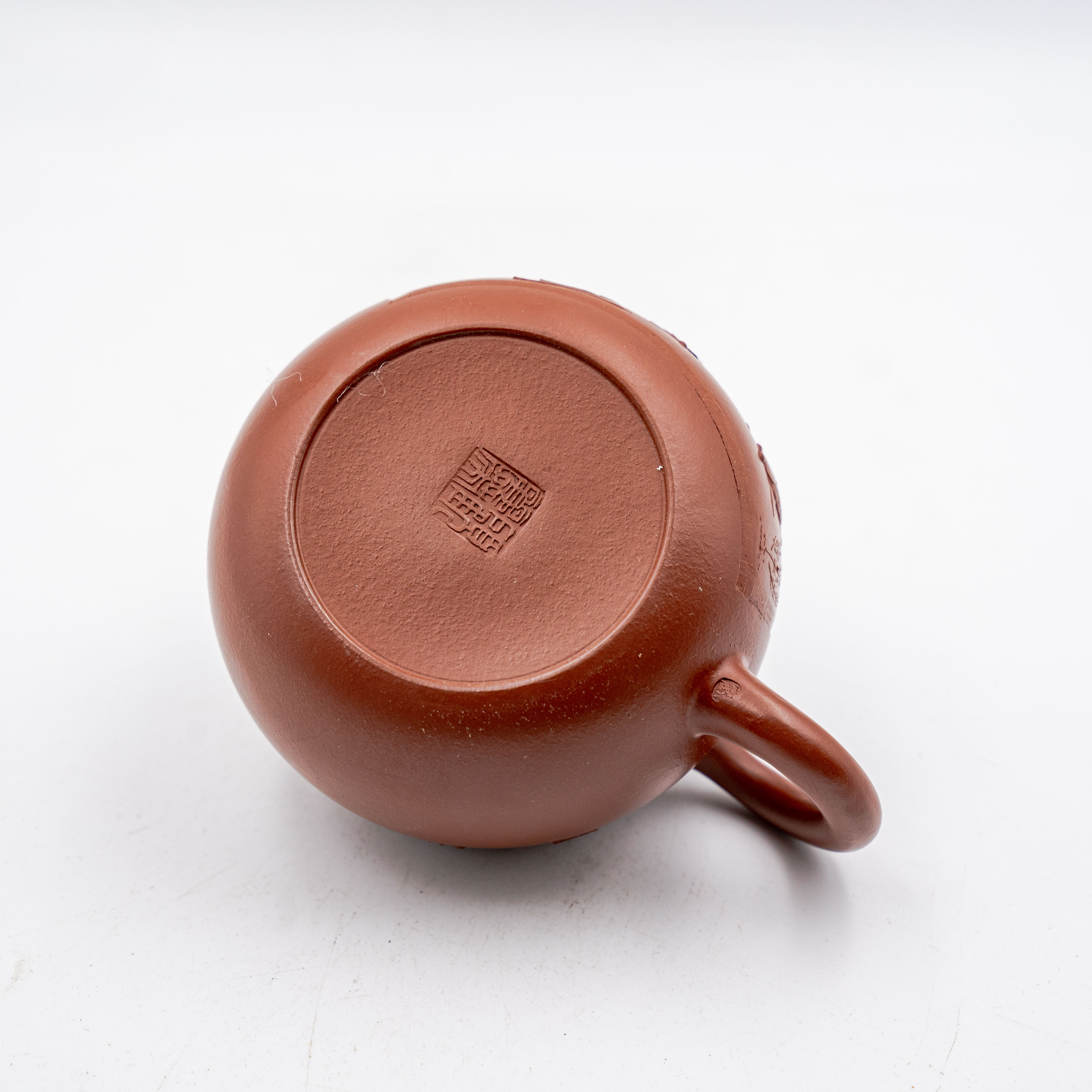 Handcrafted Yixing Red Clay Xishi Teapot with Carved Floral and Fish Design