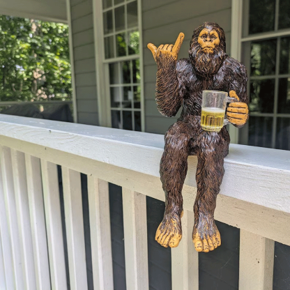 Party is drinking beer Bigfoot Yeti statue