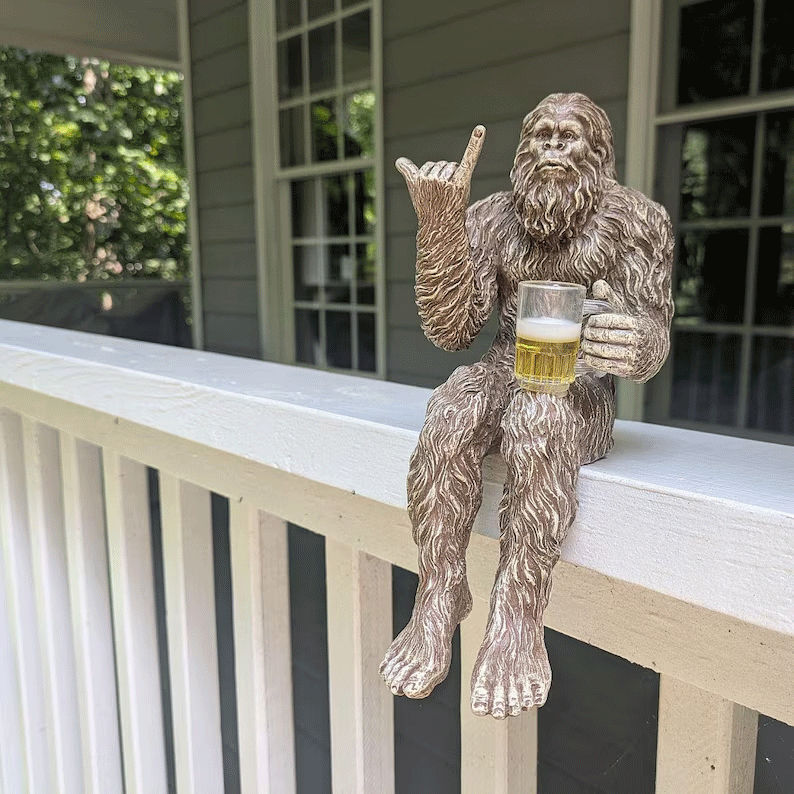 Party is drinking beer Bigfoot Yeti statue