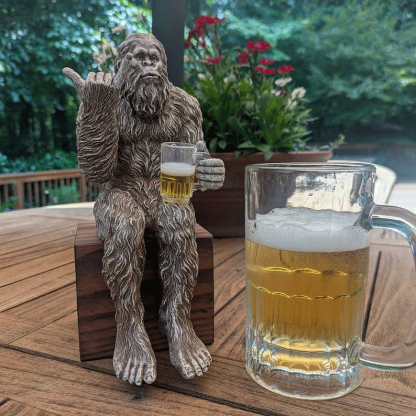 Party is drinking beer Bigfoot Yeti statue