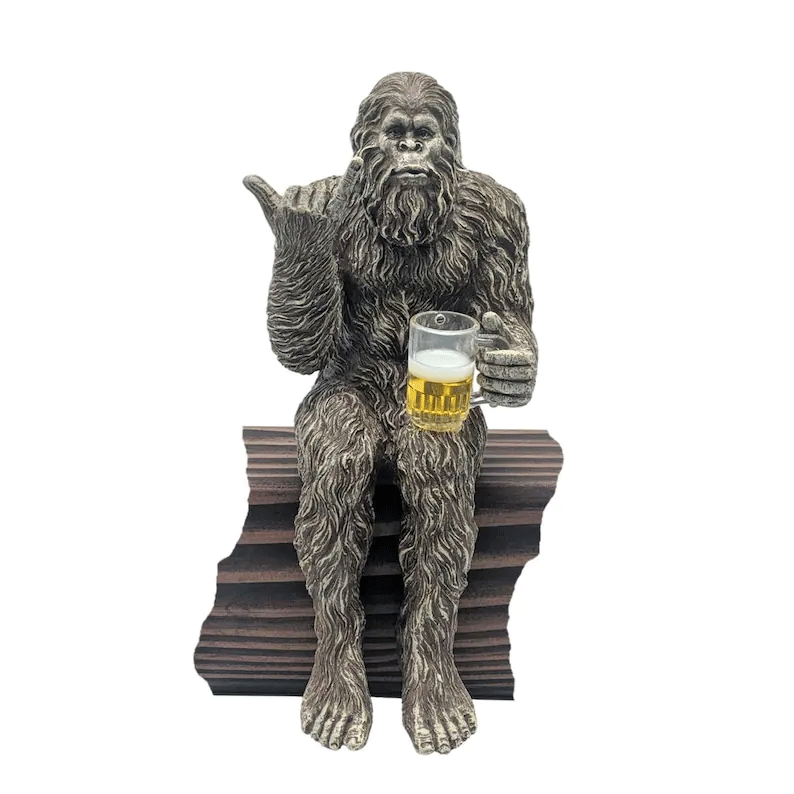 Party is drinking beer Bigfoot Yeti statue