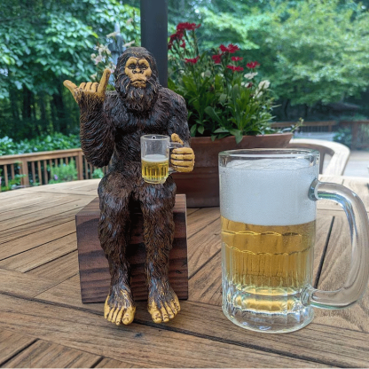 Party is drinking beer Bigfoot Yeti statue