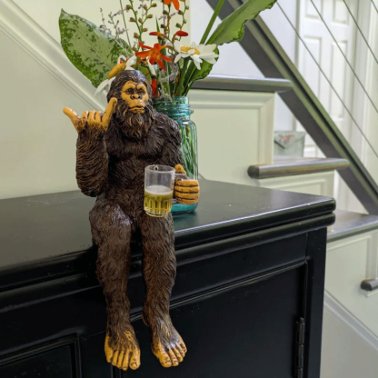 Party is drinking beer Bigfoot Yeti statue