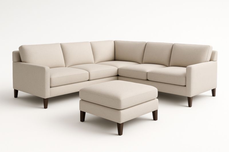 Canapé d'angle en tissu beige avec pouf