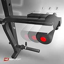 Close-up of a leg extension machine with adjustable weight plates, numbered settings, and a padded roller. Red Hop-Sport logo in corner.