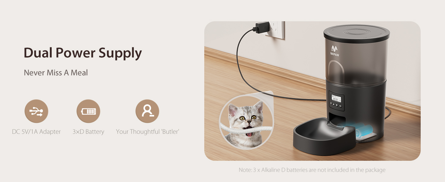 Zwarte automatische voerbak voor huisdieren met dubbele voeding. Tot de functies behoren een AC-adapter, batterijback-up en WiFi-connectiviteit. Kattengezicht zichtbaar in ronde opening.