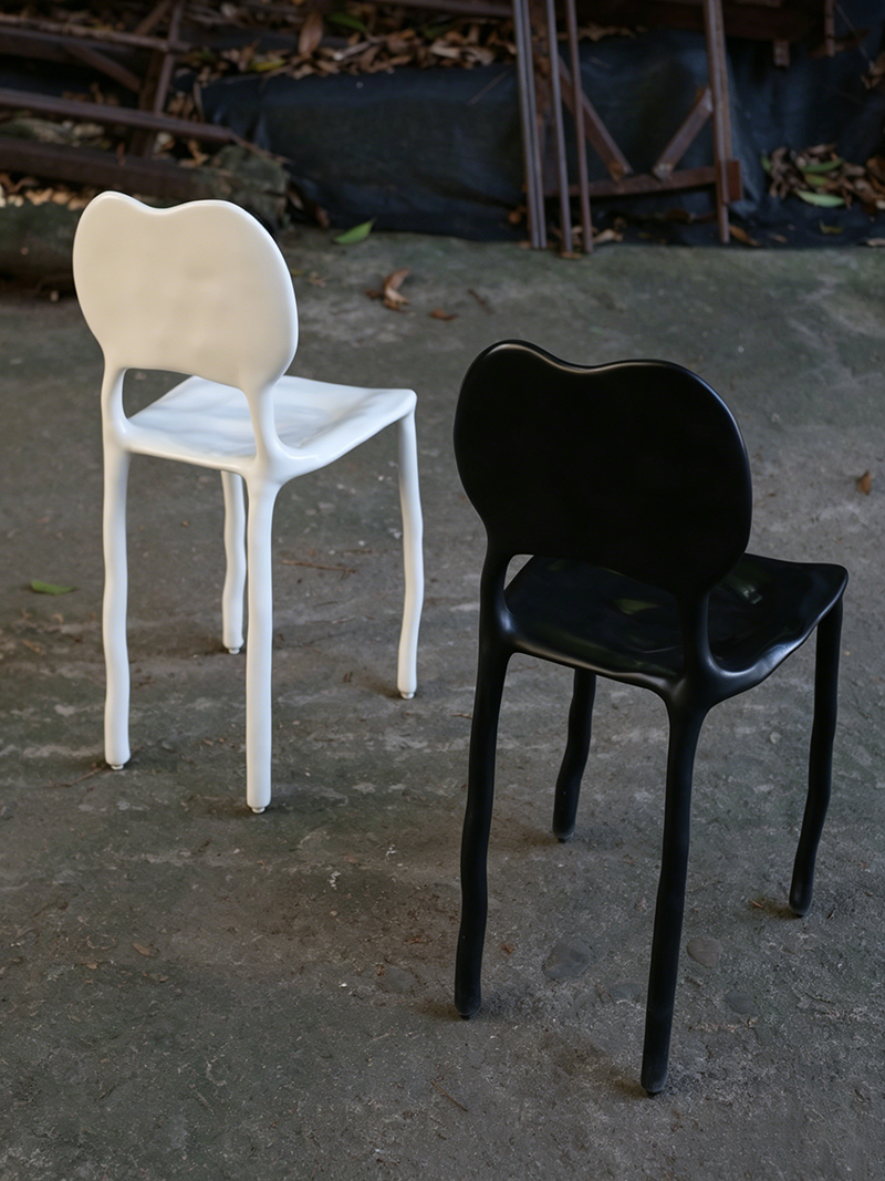 Surrealist minimalist fluid-shaped handmade solid wood melting chair