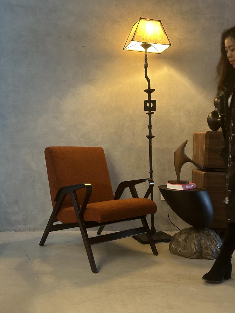 Mid-century industrial style terracotta orange solid wood lounge armchair with soft upholstery