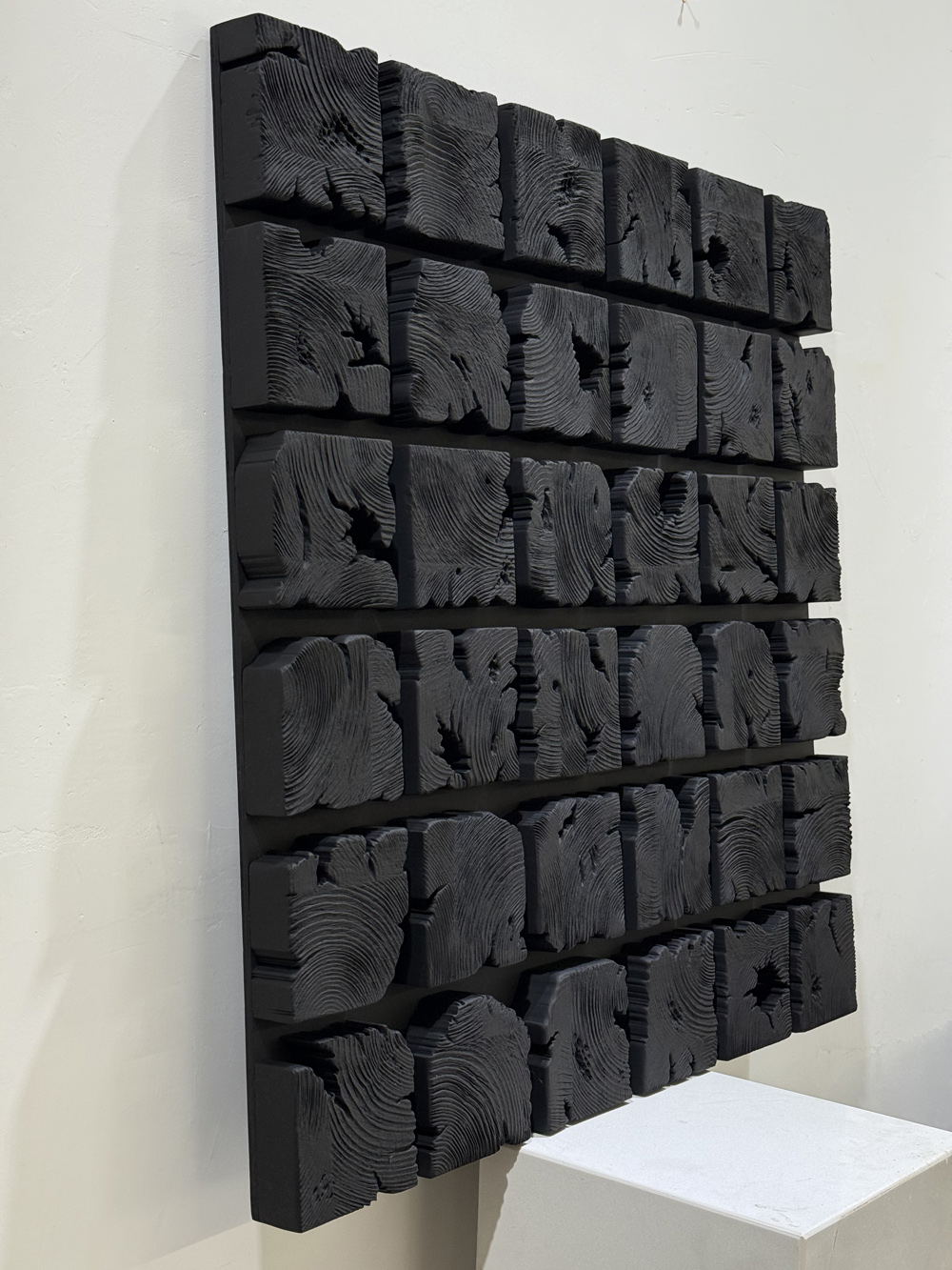 Black wooden blocks wall decor 