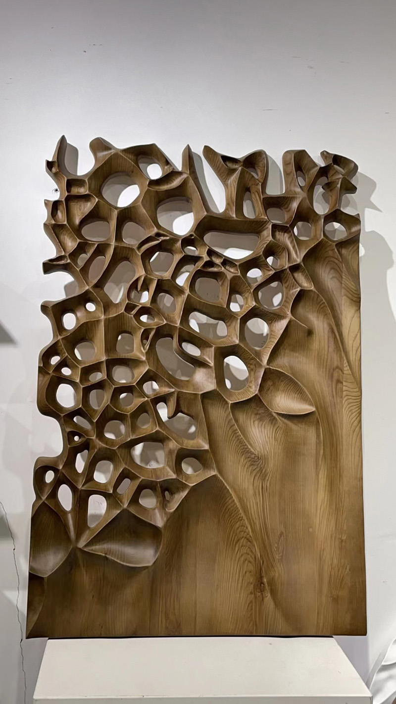 Hand-carved wooden wall sculpture