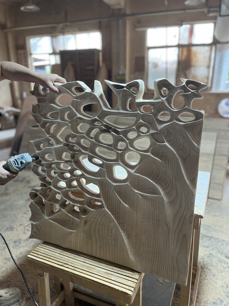 Hand-carved wooden wall sculpture