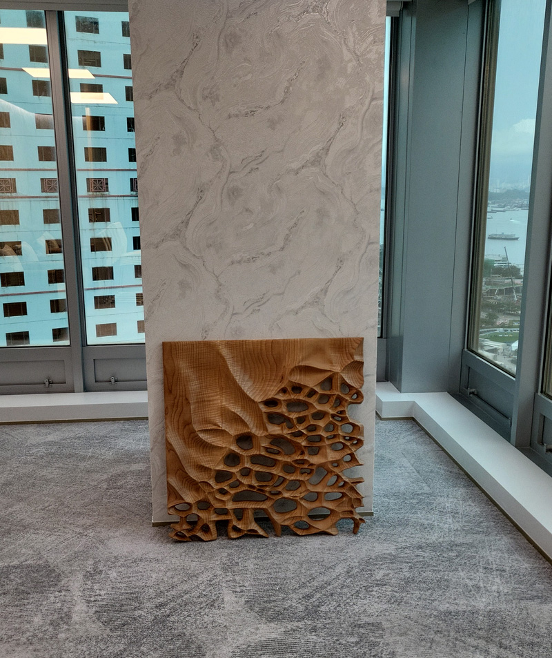 Hand-carved wooden wall sculpture