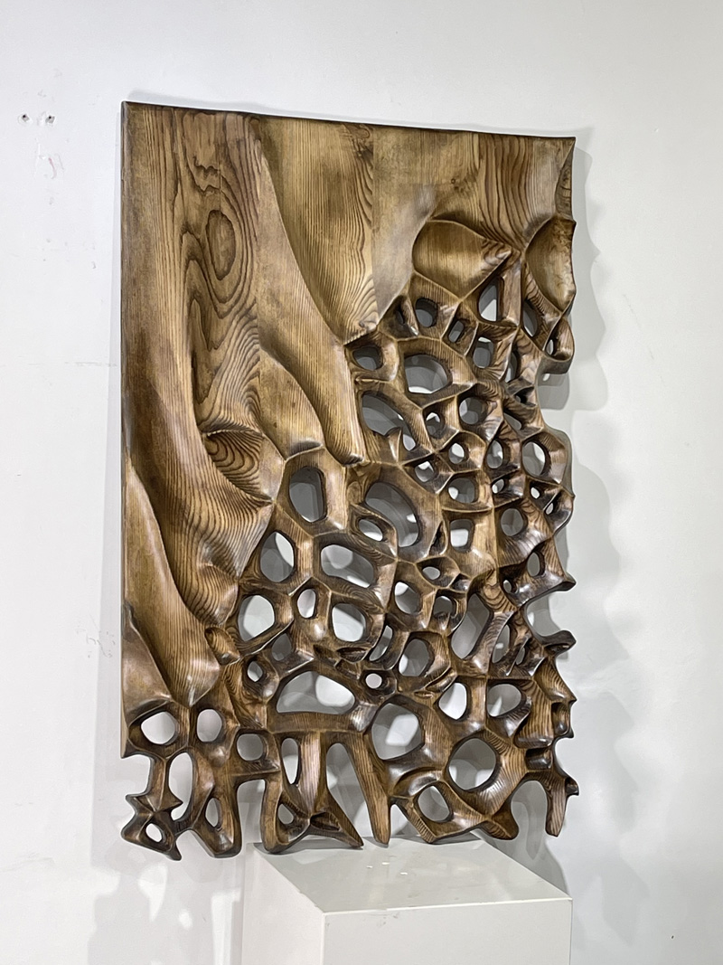 Hand-carved wooden wall sculpture